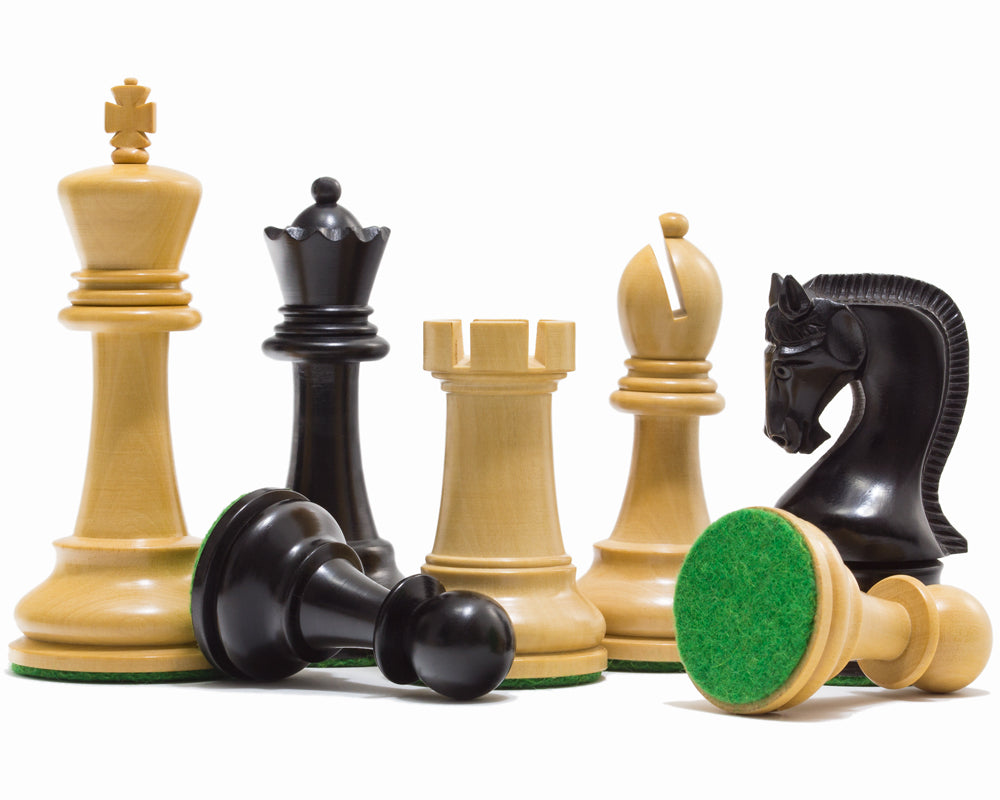 Black and natural Leningrad chessmen showing turned profiles and green felted bases