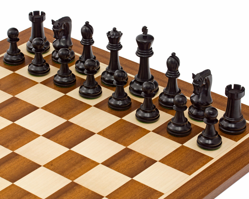 Black Leningrad-style chessmen arranged on a mahogany and maple chessboard