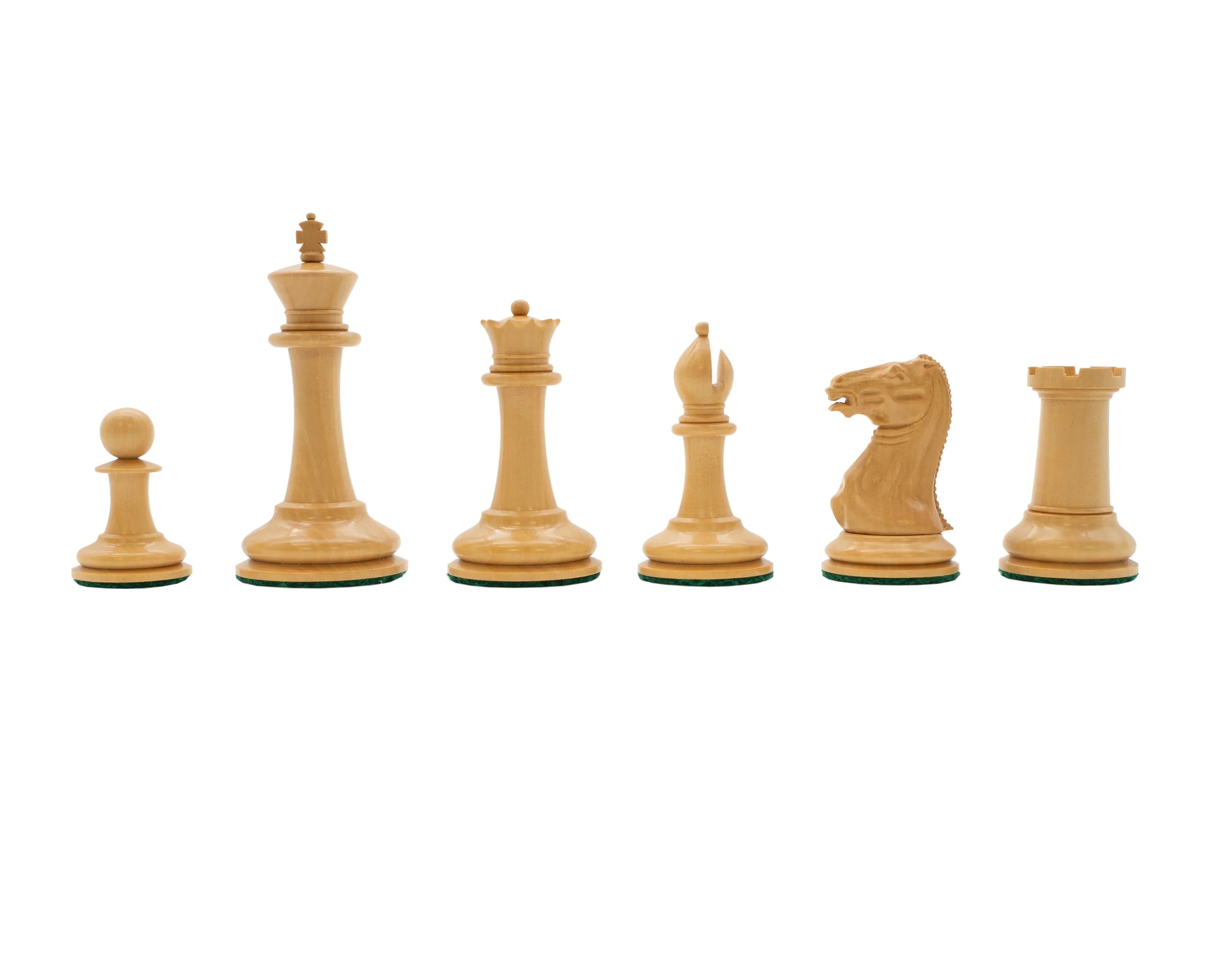 Detailed Cooke style boxwood chess piece line-up including knight